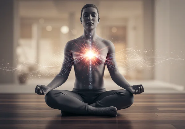 Person meditating, focusing on breath, with calm aura