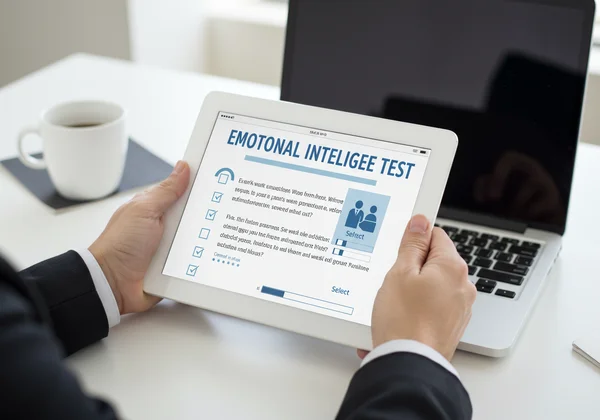 User taking an emotional intelligence test on a tablet