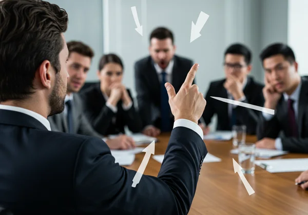 Person pointing finger, avoiding accountability at work